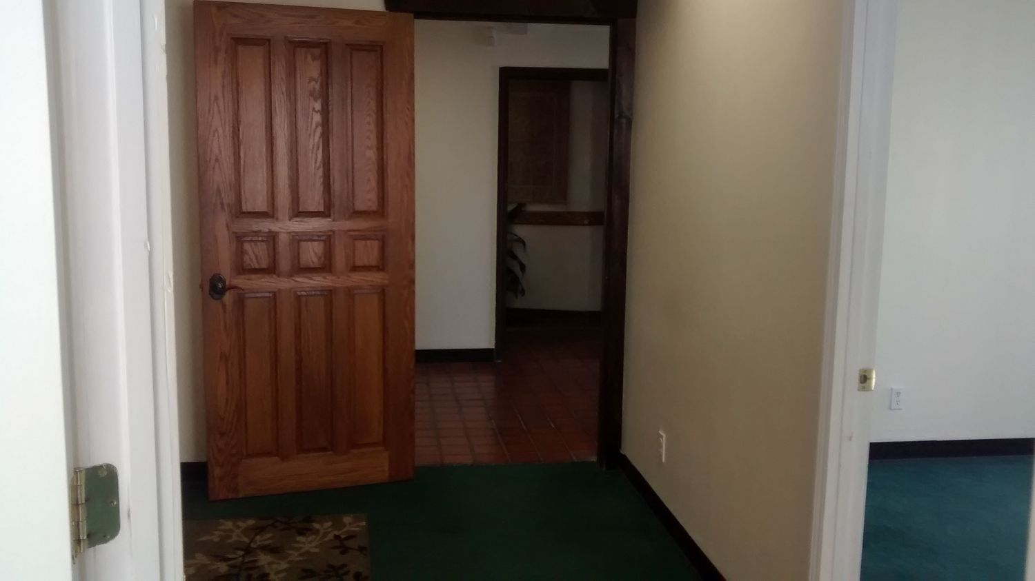 TILE ENTRY AND RECEPTION, 3 OFFICES AND LARGER ROOM.